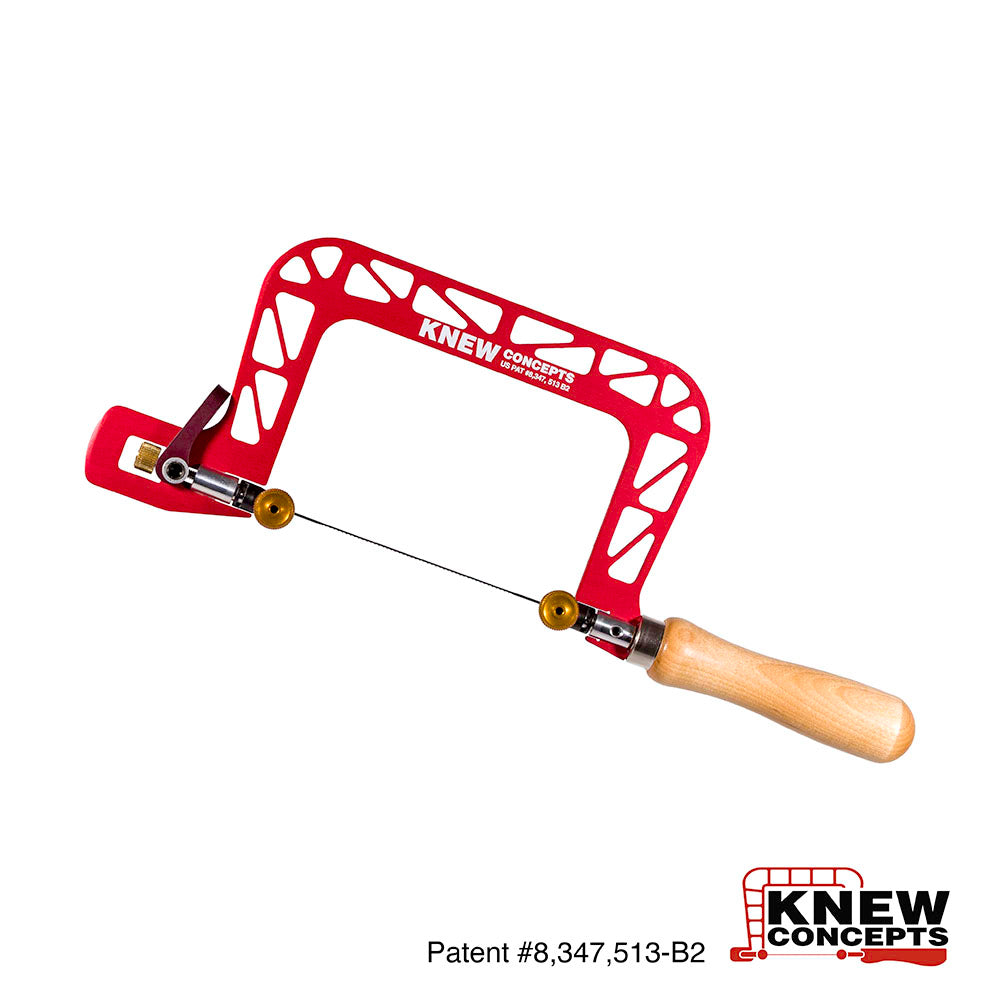 Red fret saw with wooden handle on a white background, branded 'Knew Concepts'.